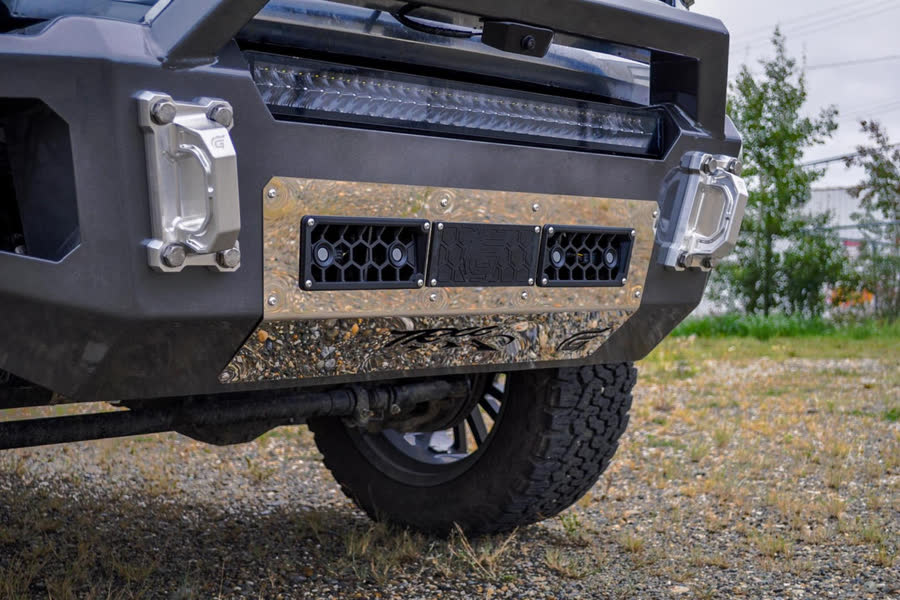 Close-up of a Gridiron Prerunner bumper on a Ford Super Duty with LED light bar and skid plate