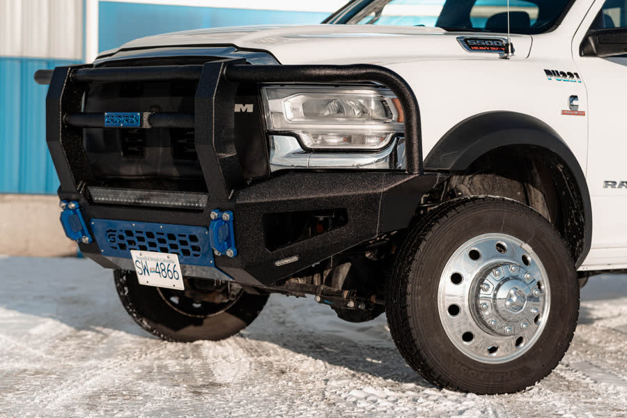 White Ram dually with a black Gridiron Full Tube front bumper